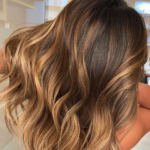 “Toasted caramel brunette with soft highlights by Avalon stylists”